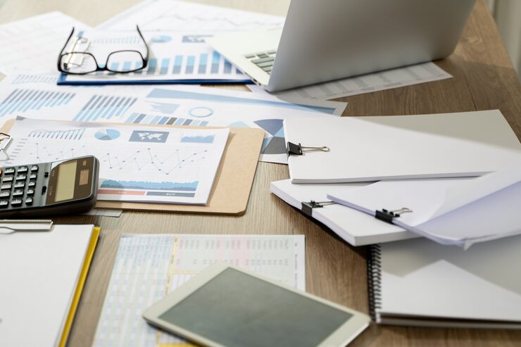 businessman desk with paper charts calculator 36325 2617 CMPasesoría